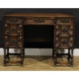 A Charles II inspired oak desk, rectangular top above an arrangement of drawers, 77.5cm high, 106.