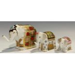 A Royal Crown Derby paperweight, Elephant, printed in the 1128 pattern, trunk raised, gold