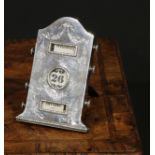 An Edwardian silver arched rectangular easel perpetual desk calendar, engraved in the Neo-