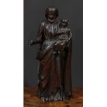 An 18th century Continental softwood figure, carved as Christ holding an infant, 50cm high, c.1700-