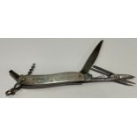 A Victorian silver multi-tool pocket knife, with corkscrew, penknife, scissors and other utensils,