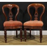 A pair of late Victorian mahogany J. Reilly's patent dining chairs, stamped, the splats carved with