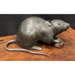 Japanese School (Meiji period), a dark and brown patinated bronze, of a rat holding a chestnut, 19cm