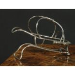 Garrard & Co - an early 20th century E.P.N.S patent wine bottle cradle or pourer, sprung retention