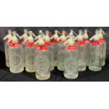 Advertising - a collection of etched clear glass soda syphons, early 20th century and later,