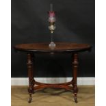 A Victorian Aesthetic Movement amboyna banded walnut and parcel-ebonised centre table, oval top,