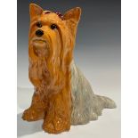 A Beswick fireside model, of a Yorkshire Terrier, seated with ribbon, 26cm high, impressed mark,