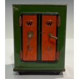 A novelty tinplate moneybox, as a two door safe on wheels, 11.5cm high