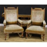 An Arts & Crafts oak three piece drawing room suite, comprising chaise longue and a pair of