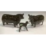 A set of three Beswick Aberdeen Angus cattle, a bull, a cow and a calf (3)
