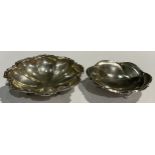A sterling silver lobed dish, moulded anthemion scroll border, resting on three scroll feet,