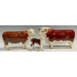 A set of three Beswick Hereford cattle models, Champion of Champions bull, cow and calf (3)