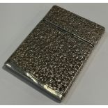 An Indian silver visiting card case, repoussé worked with intricate small blossom, 10cm,