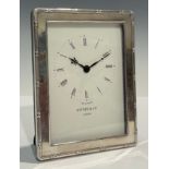 A silver rectangular desk clock, 15.5cm x 11.5cm, Kitney & Co, London 1994