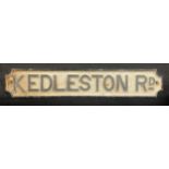 A cast iron street sign, Kedleston Road, painted in black and white, 90cm wide