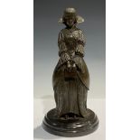 After D H Chiparus, a bronzed metal figure, of a young lady holding a book, 30.5cm high