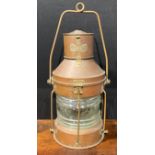 A copper and brass ship’s lantern, swing carry handle, 62cm high over handle