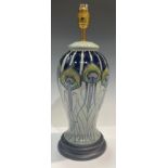 A Moorcroft Peacock Parade pattern inverted baluster table lamp, stepped base, 29cm, boxed