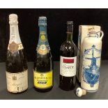 A bottle of Pol Roger Champagne; a bottle of Heidsieck & Co. Monopole Champagne; a bottle of vintage