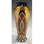 A Moorcroft slender inverted baluster vase, tube lined with stylised Nordic entwined serpents, 21cm,