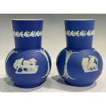 A pair of Wedgwood Jasperware type, ovoid vases, sprigged with classical deities, 14.5cm,