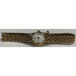 A lady's 9ct gold Rotary watch, oval dial, Roman numerals, 9ct gold integral bracelet strap, 18g