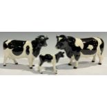 A set of three Beswick Fresian cattle models, Champion Coddington Hilt Bar bull, Champion Claybury