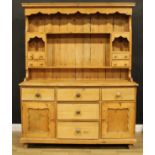 An early 20th century pine dresser, 199.5cm high, 161.5cm wide, 59cm deep