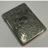 A Victorian silver rounded rectangular visiting card case, chased and engraved with fronds of fern