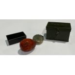 A 19th century paper mache snuff box; a Vesta case; a coquilla nut pomander; a World War II military