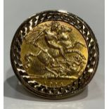 A George V gold half sovereign ring, 1914, size M, 9ct gold mounted, 8.6g