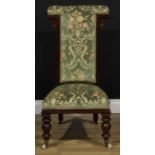 A Victorian mahogany prie-dieu chair, green floral upholstery, turned forelegs, ceramic casters,