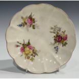 An early 19th century Derby lobed circular dish, outside decorated, painted with bunches of