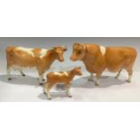 A set of three Beswick Guernsey cattle models, Champion Sabrina's Sir Richmond 14th bull, a cow