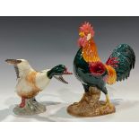 A Beswick model, of a Sheldrake Duck, 15cm high, model no.994; another, Leghorn Rooster, 24cm