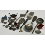 An early 20th century miniature pewter dinner and tea service; a miniature pewter Viking longship;