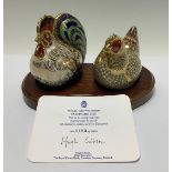 An associated pair of Royal Crown Derby paperweights, Farmyard Hen, limited edition 3,183/5,000,