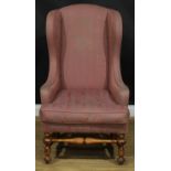 A William & Mary Revival wing chair, stuffed-over upholstery, squab cushion, turned and blocked