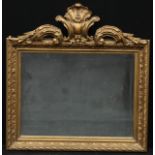 A giltwood and gesso rectangular looking glass, bevelled mirror plate, the frame applied with