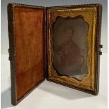 Photography - a 19th century ambrotype photograph, of a young gentleman seated in a balloon back