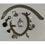 A silver curb link Albert chain, 37.9g; a sterling silver charm bracelet, including wishing well,