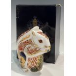 A Royal Crown Derby paperweight, Stoney Middleton Squirrel, commissioned exclusively by John