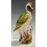 A Royal Crown Derby paperweight, Green Woodpecker, gold stopper, 17.5cm, printed mark in red