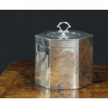 An Edwardian silver lozenge shaped tea caddy, of George III design, hinged cover with batwing