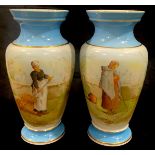 A pair of continental pedestal ovoid opaque glass vases, printed and painted with a pair of Low