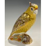 A Royal Crown Derby paperweight, Citron Cockatoo, signed in gold by designer Tien Manh Dinh and