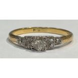 An Art Deco 18ct gold diamond ring, the central princess cut stone set to angles, approx. 4mm,