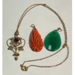 A gold coloured metal mounted coral pendant; a Jade pendant; an Art Noveau pendant necklace (3)