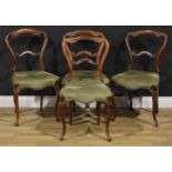 A set of four Victorian rosewood dining chairs, 86cm high, 45cm wide, the seat 35cm deep (4)