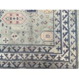 A Middle-Eastern rectangular wool rug or carpet, 316cm x 273cm
